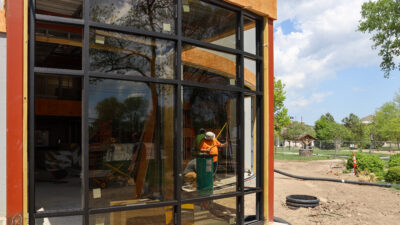 Glass being installed in front of Pioneer Hall